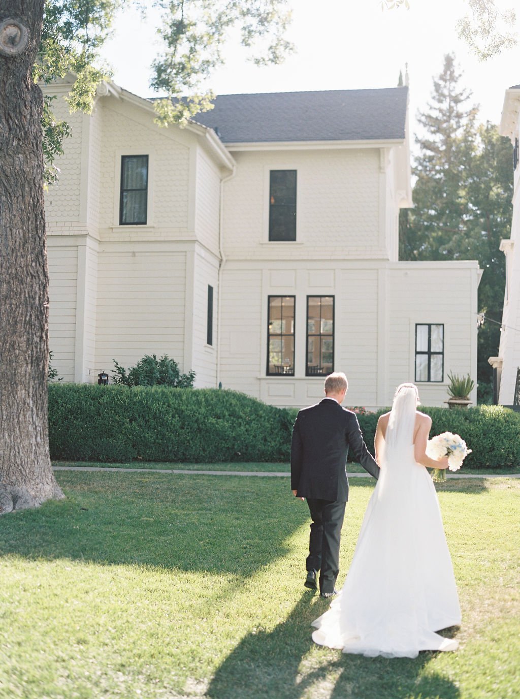  bride and groom walking at French Garden Inspired Park Winters Wedding 