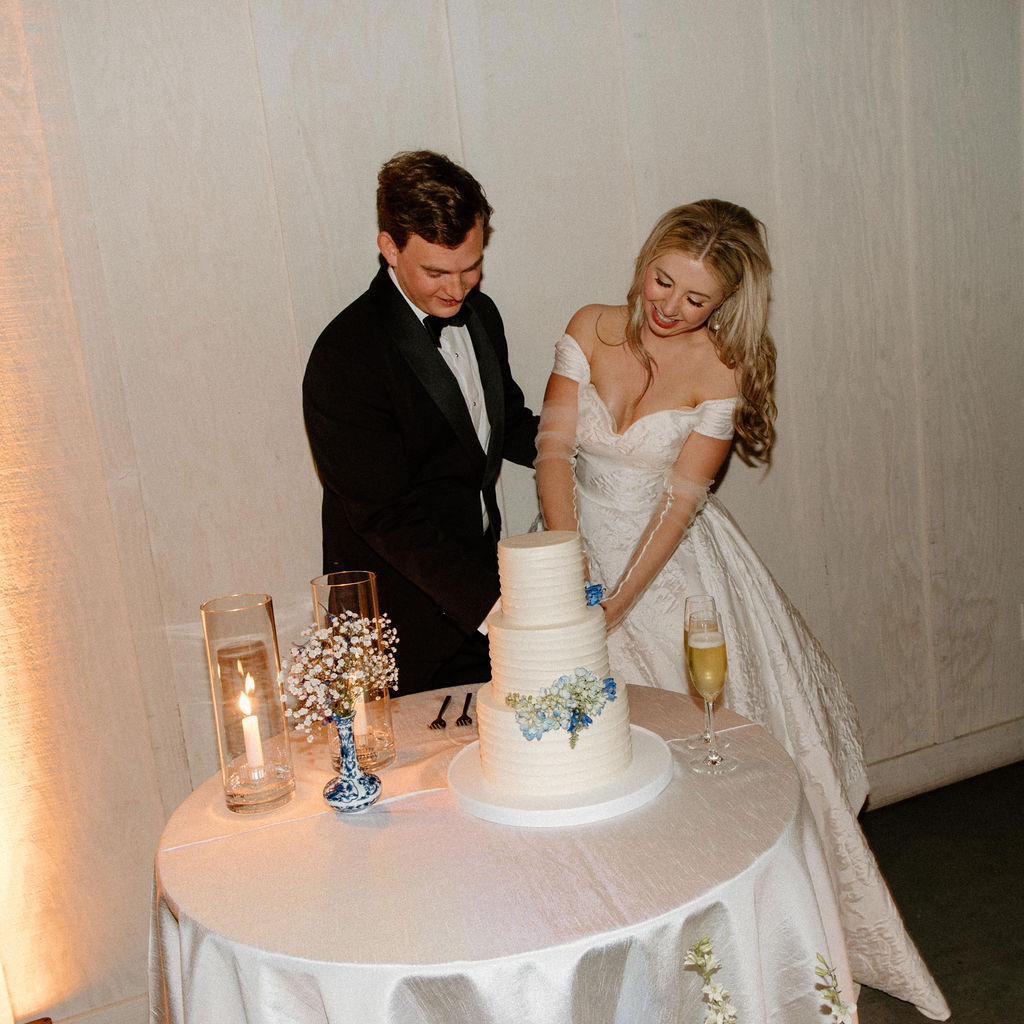 bride and groom cutting cake during sonoma wedding day
