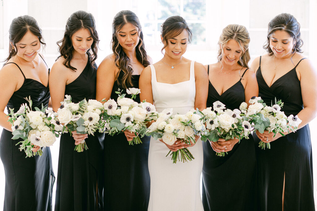 bride with bridesmaids after getting ready