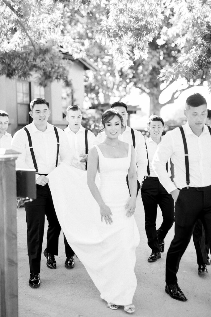 photo of bride with groomsmen
