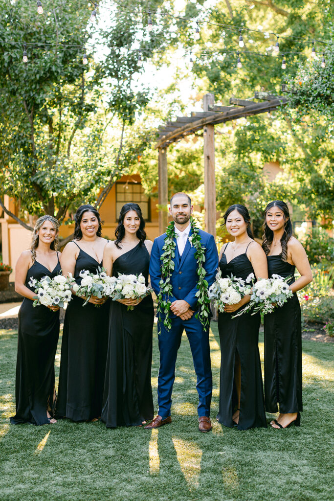 groom with bridesmaids photo