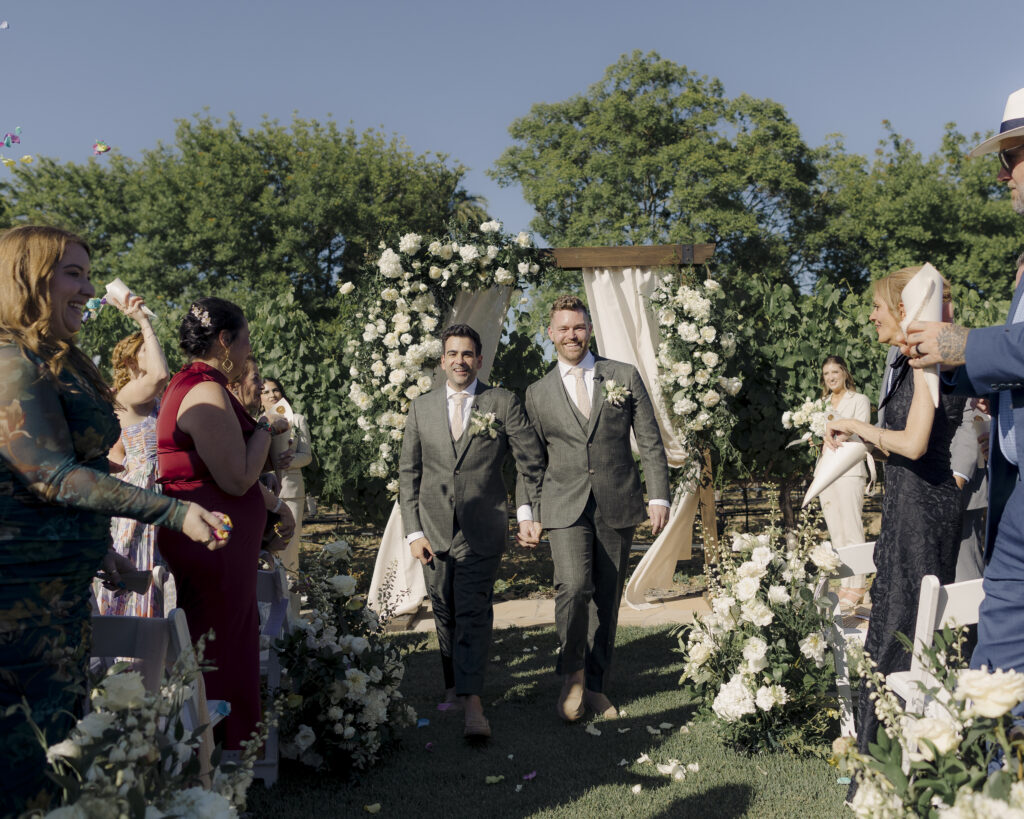 photo of grooms at wedding ceremony