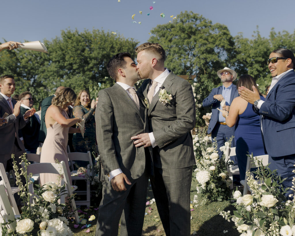 photo of grooms at wedding ceremony