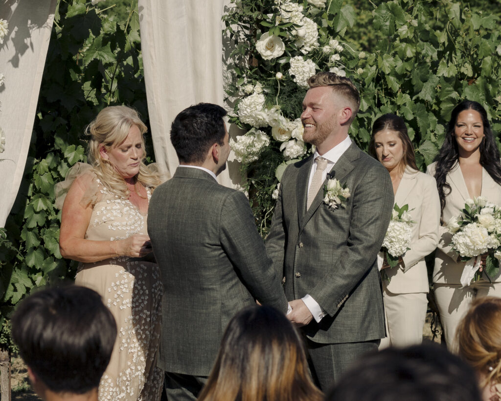 photo of grooms at wedding ceremony