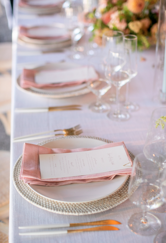 menus sitting on pink napkins 