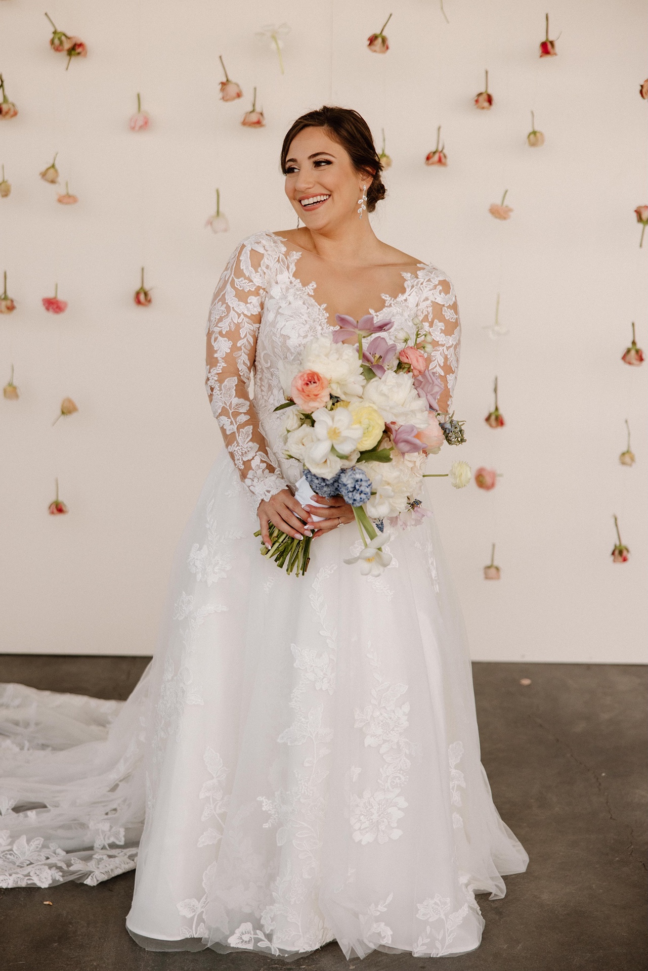 Bride holding bouquet at her Harrow Cellars wedding