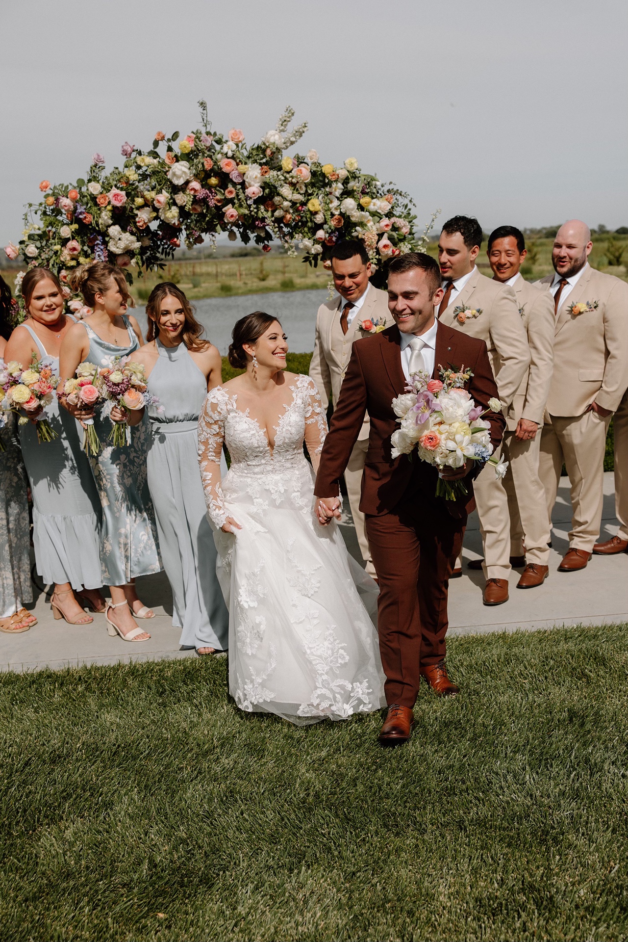 Bride and groom with their wedding party at Harrow Cellars